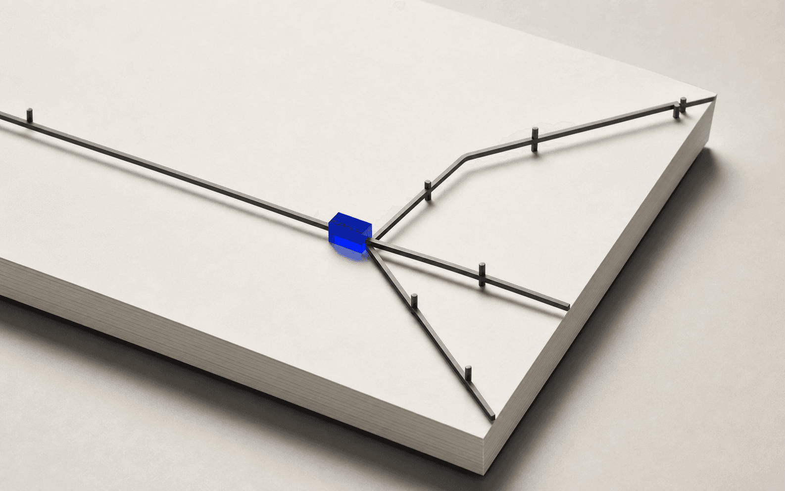 A physical archive of paper source records arranged around one cobalt-blue reference marker